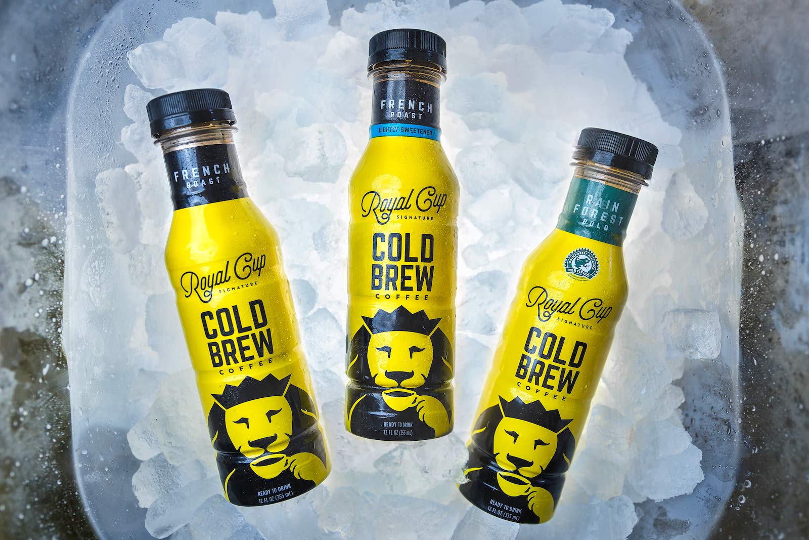 Image of 3 cold brew coffee bottles on ice for Royal Cup coffee and tea.