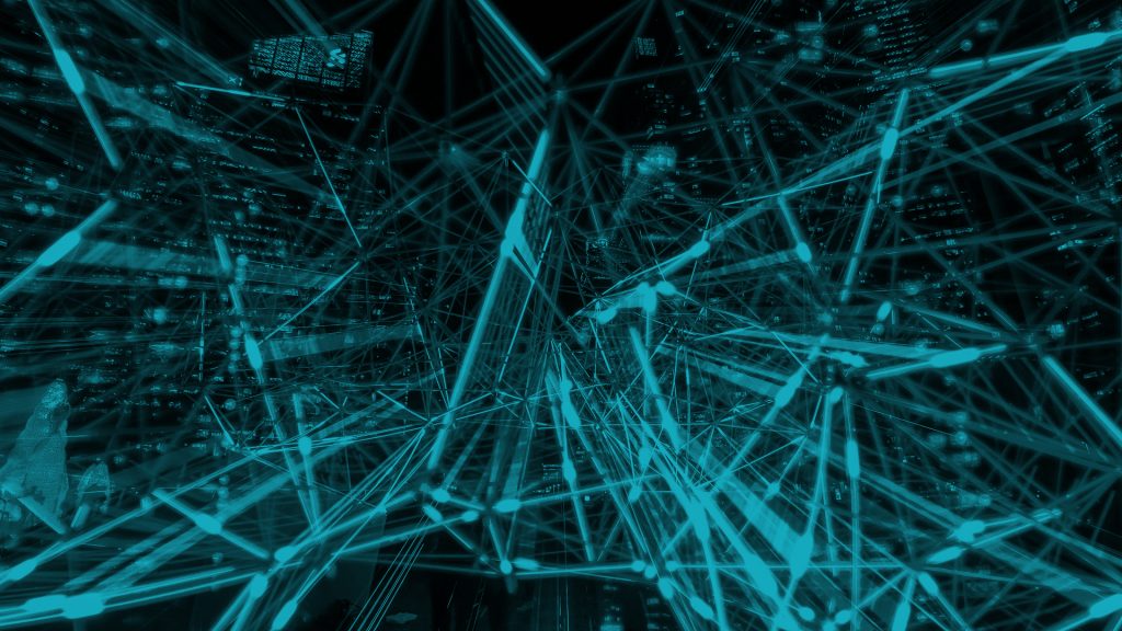 A visual representation of the interconnected web. There is a cityscape in the background but your attention is focused on all of the lines connecting to each other in the foreground. The entire photo has a light blue tint overlay.