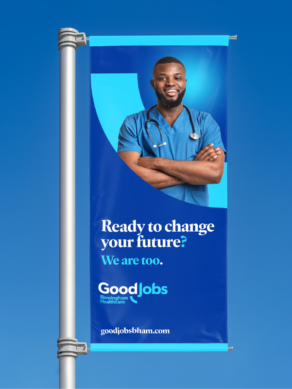 Street side banner in good jobs branding that reads "Ready to change your future? We are too."